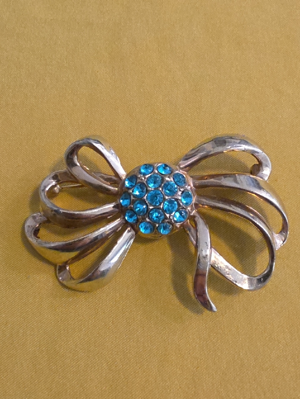 Art Deco Style Vintage Gold-Tone Bow Brooch with Aqua Blue Rhinestone Center